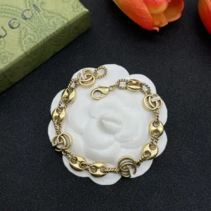 18k Yellow gold plated GG bracelet with gg logo and oval gold charms
