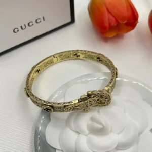 Alternative view of 18k Yellow gold plated GG bangle belt with engraving