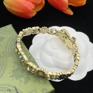 Alternative view of 18k Yellow gold plated GG bracelet belt with gg logos and flowers