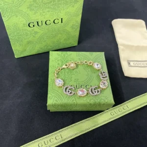 18k Yellow gold plated GG bracelet with big stone and stones on logo