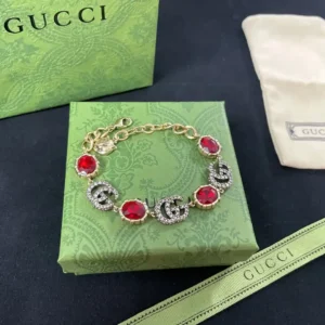 Alternative view of 18k Yellow gold plated GG bracelet with big stone and stones on logo