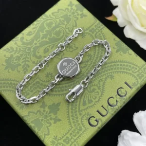 Alternative view of 18K White gold plated GG thin curb link bracelet with round disk in die centre
