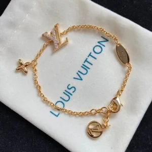 18k Yellow gold plated LV charm bracelet with stones and disk