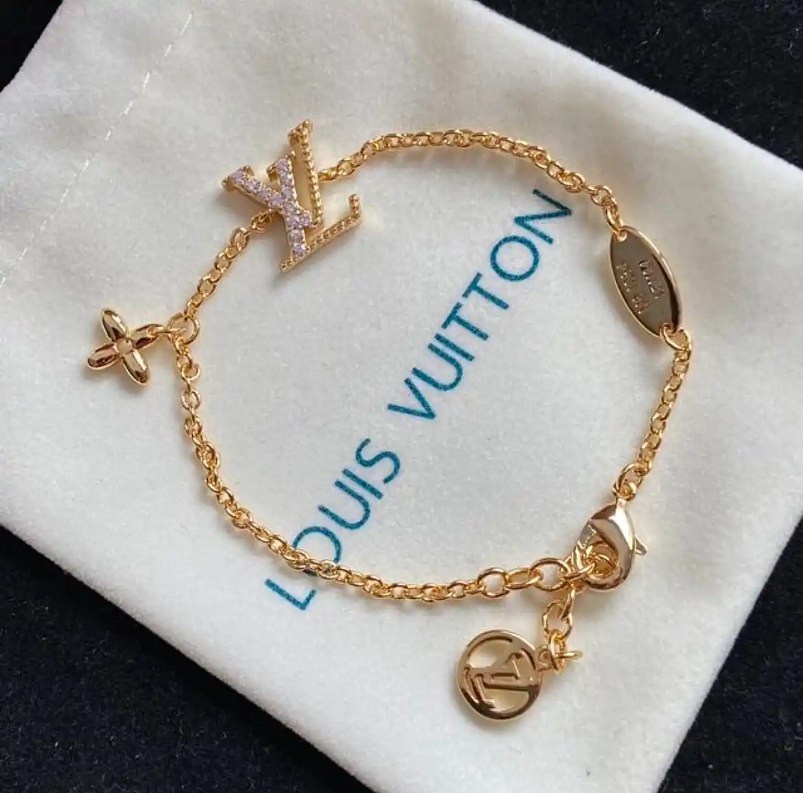 18k Yellow gold plated LV charm bracelet with stones and disk