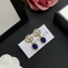 18k Gold plated drop GG earrings with Oval blue stone