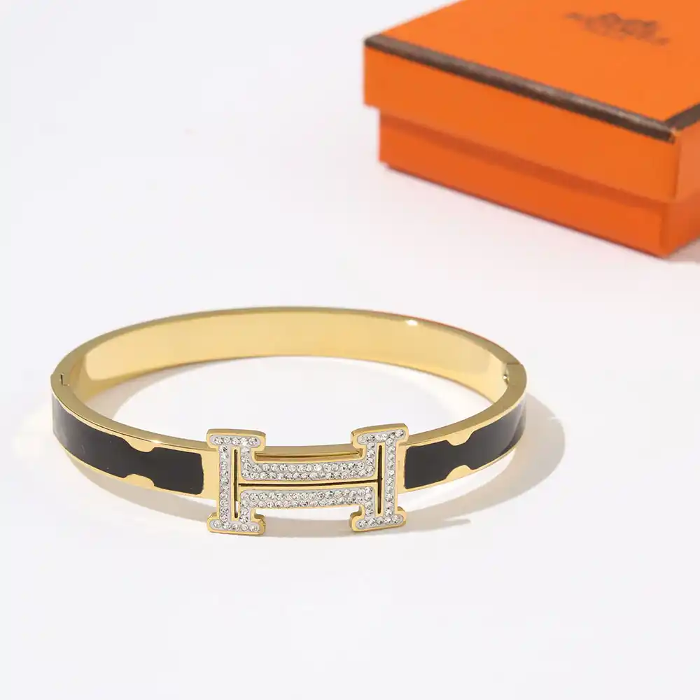 18k Yellow gold plated HM bracelet with black strip and stones on logo - Image 2