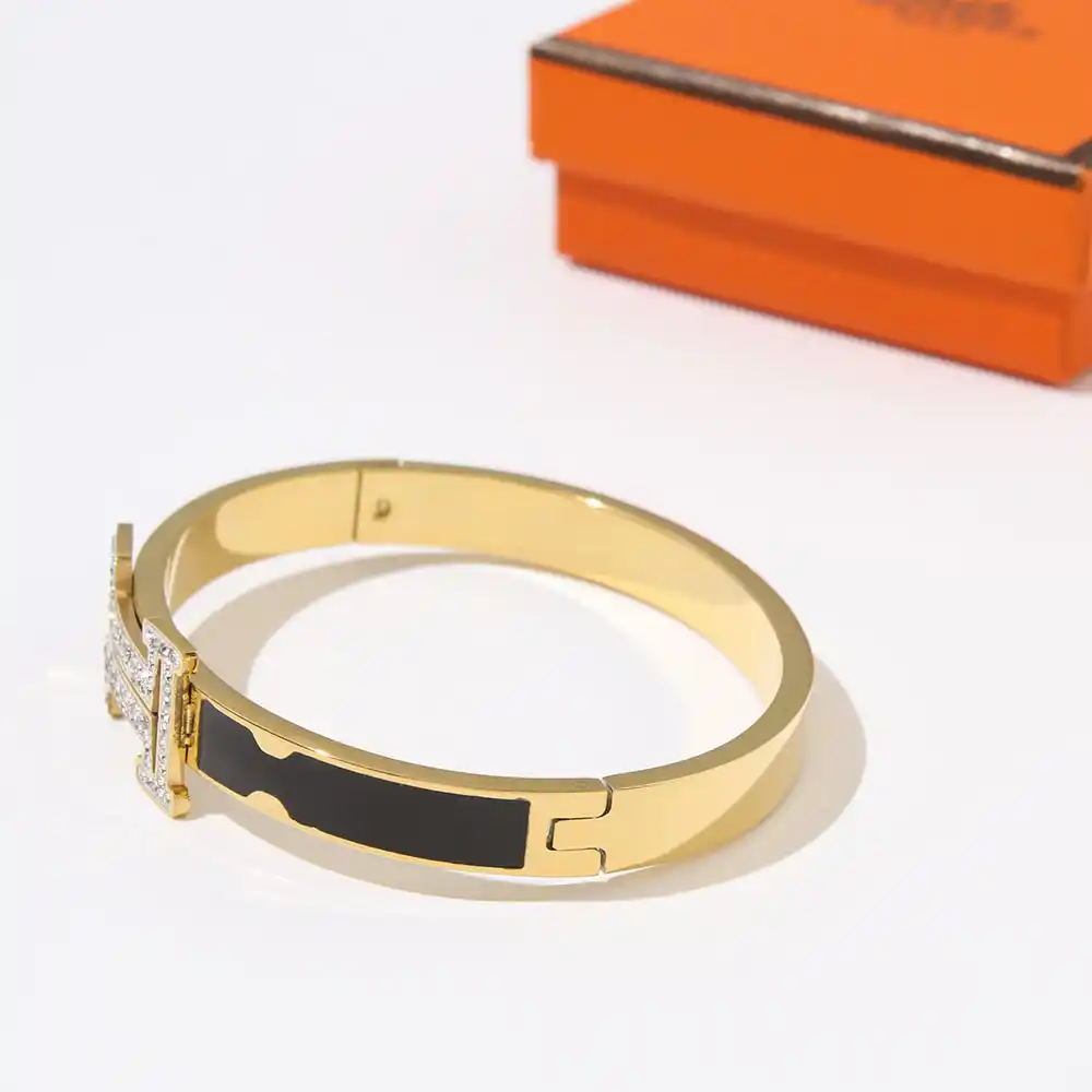 18k Yellow gold plated HM bracelet with black strip and stones on logo - Image 3