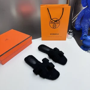 HM Black fluffy slip ons