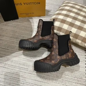 Alternative view of LV Brown boots with lv signage